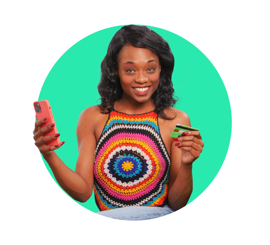 Young woman holding a smart phone and a payment card